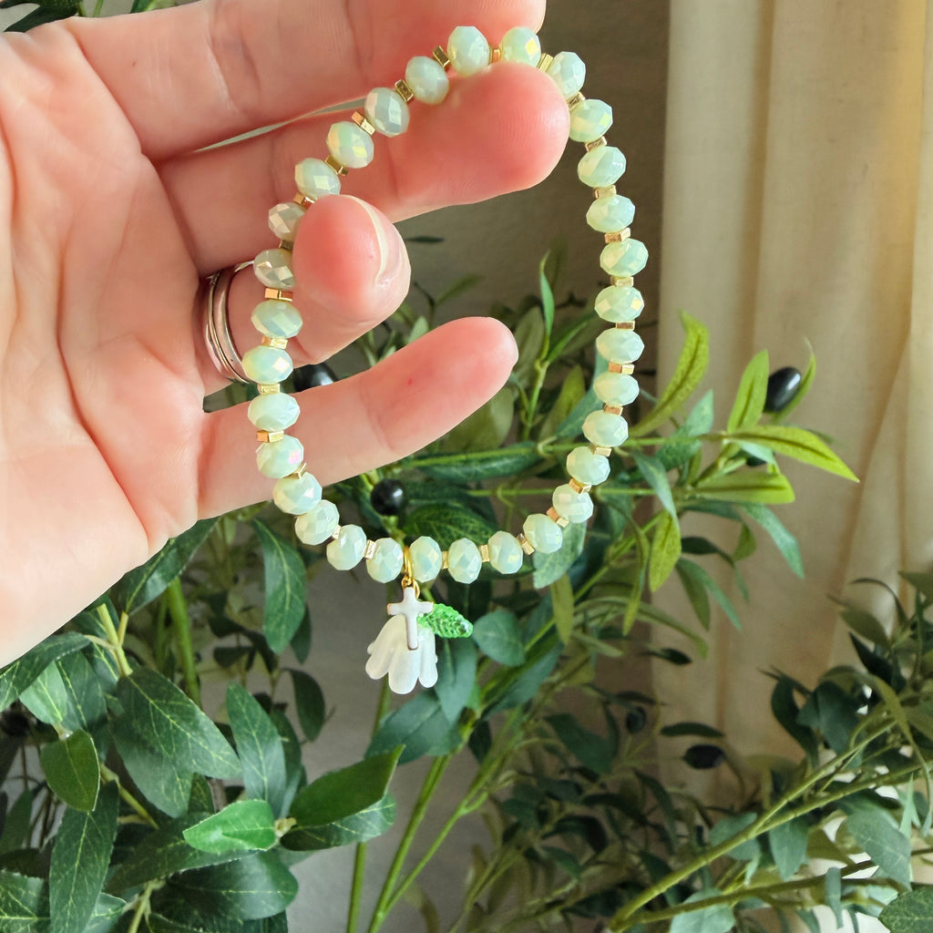 “Consider the Lillies” Handmade Glass Bead Stretch Bracelet with Flower and Mini Cross Charm