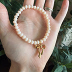 “God’s Girl” Handmade Glass Bead Stretch Bracelet with Bow Charm