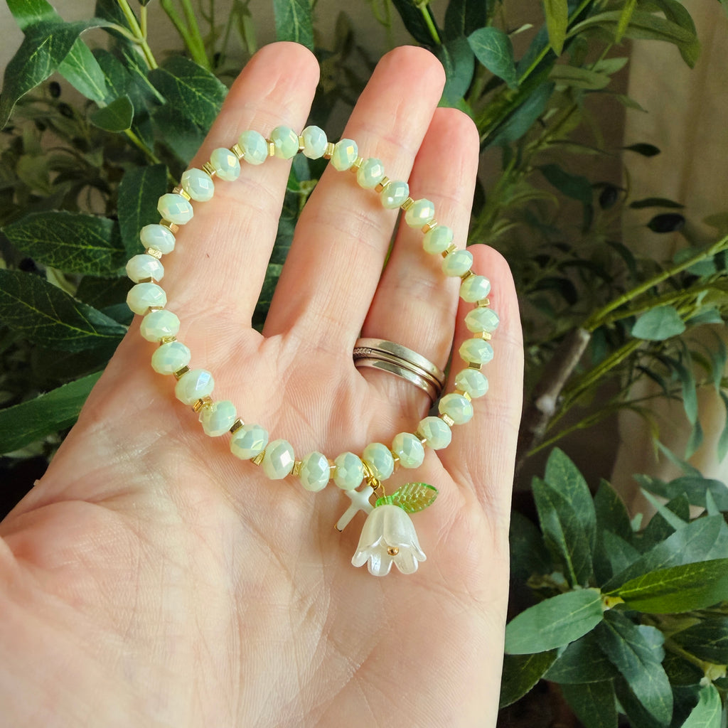 “Consider the Lillies” Handmade Glass Bead Stretch Bracelet with Flower and Mini Cross Charm