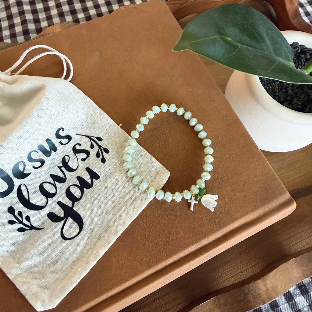 “Consider the Lillies” Handmade Glass Bead Stretch Bracelet with Flower and Mini Cross Charm