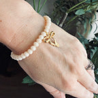 “God’s Girl” Handmade Glass Bead Stretch Bracelet with Bow Charm